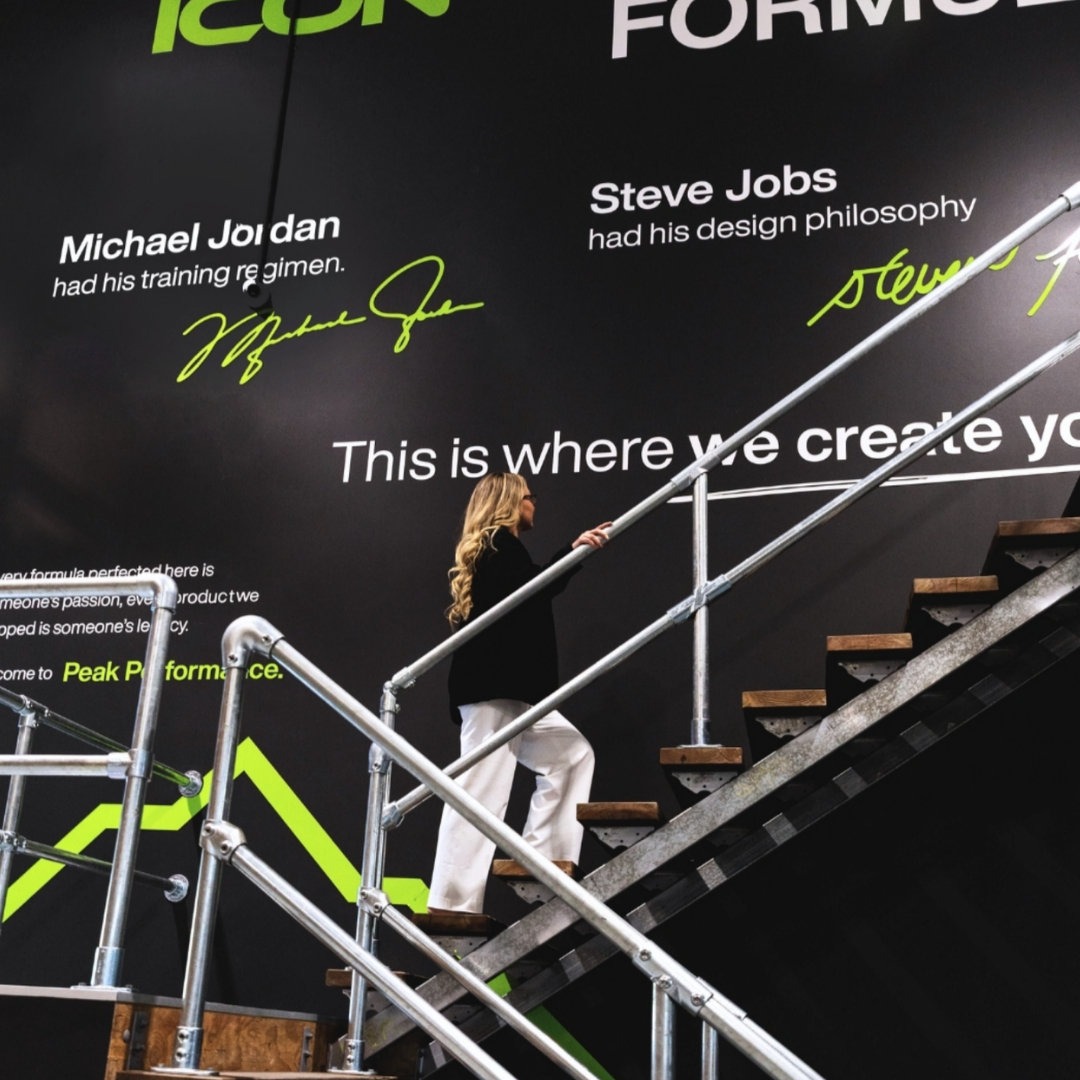 Black and lime Health Icons graphics extending across a staircase wall.